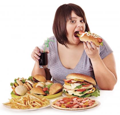 2-Overweight-woman-eating-fast-food-it-is-the-worst-food.jpg